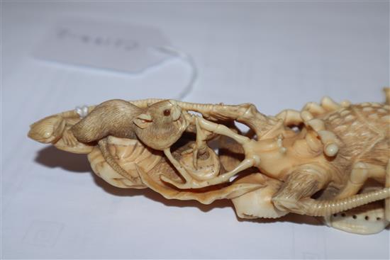 A Japanese ivory okimono of rats crawling over a lobster, early 20th century, unsigned 14.5cm